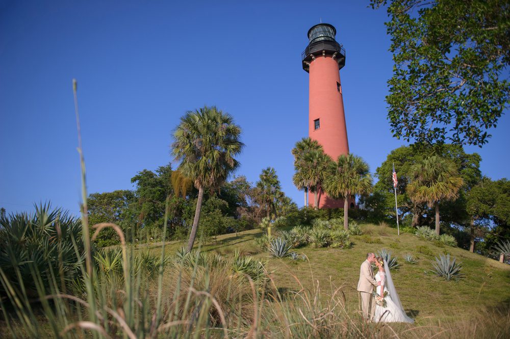 Lighthouse photo of bride and groom Poirier Wedding Photography