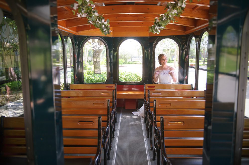 Bride leaving for ceremony on Molly's Trolleys Poirier Wedding Photography