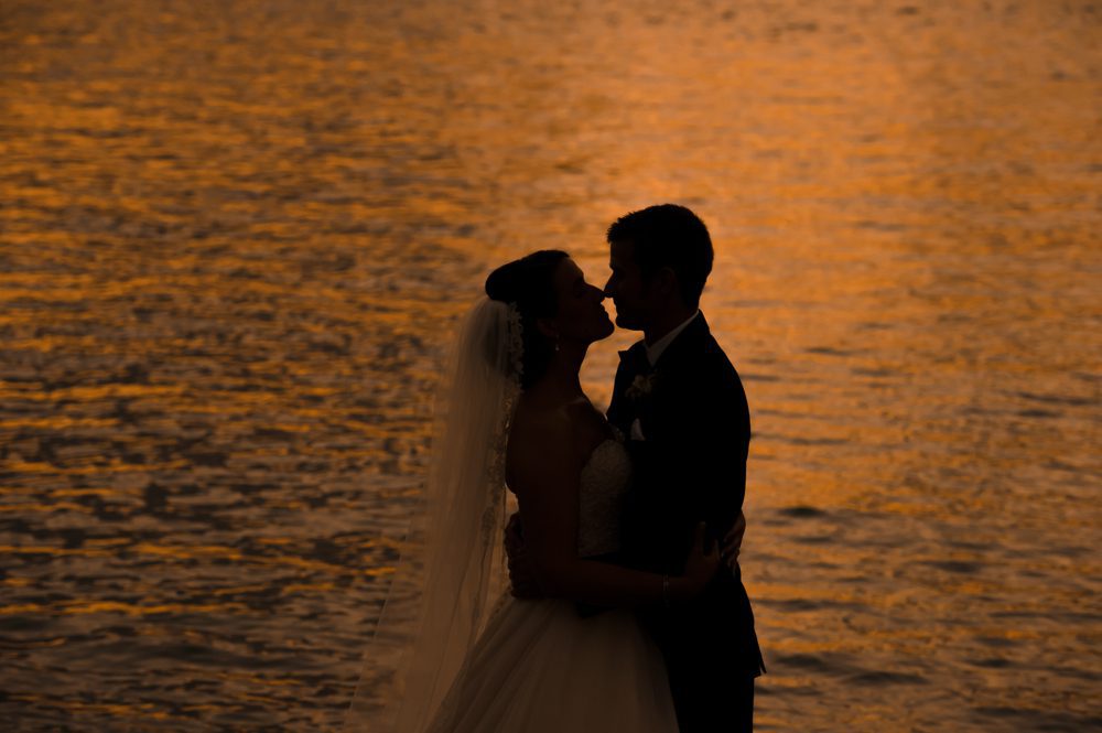 Sunset photo of bride and groom at Sailfish club wedding