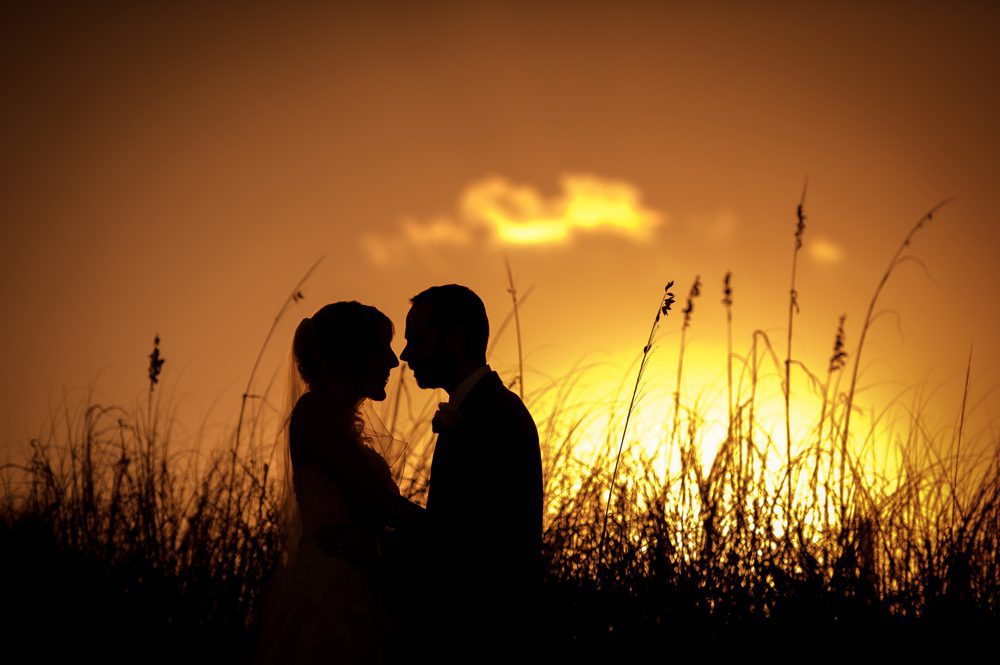 Sunset photo of bride and groom at Hilton Singer Island wedding