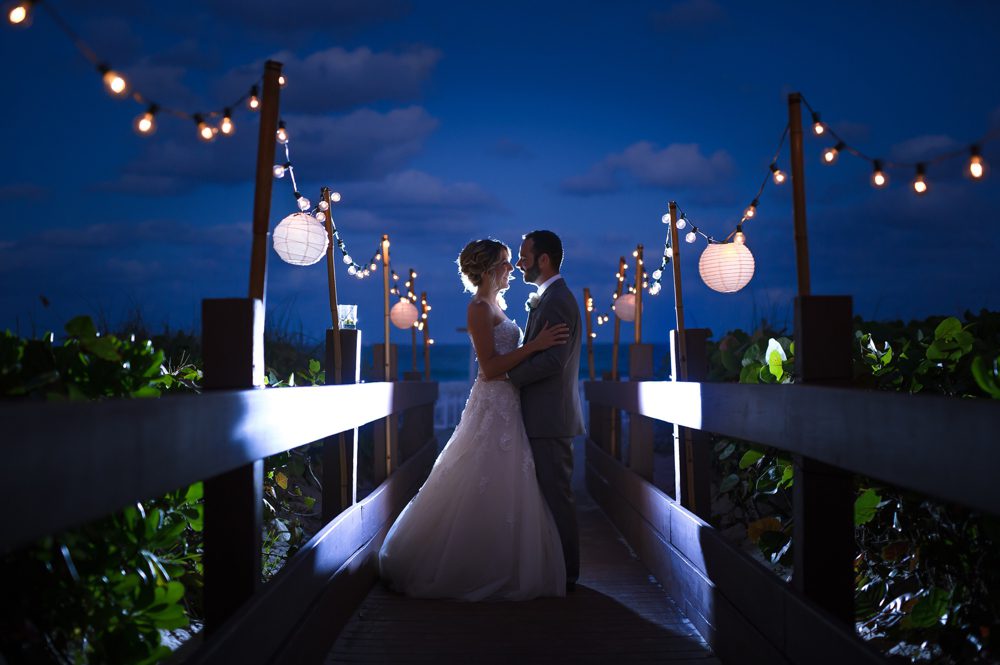 Night photo of bride and groom at Hilton Singer Island wedding