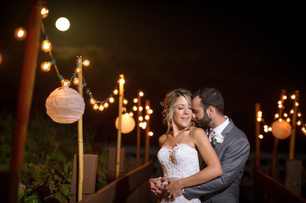 Moon light photo of bride and groom at their Palm Beach wedding